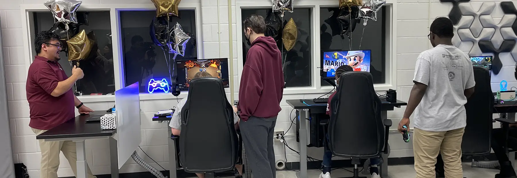 Students at multiple gaming workstations